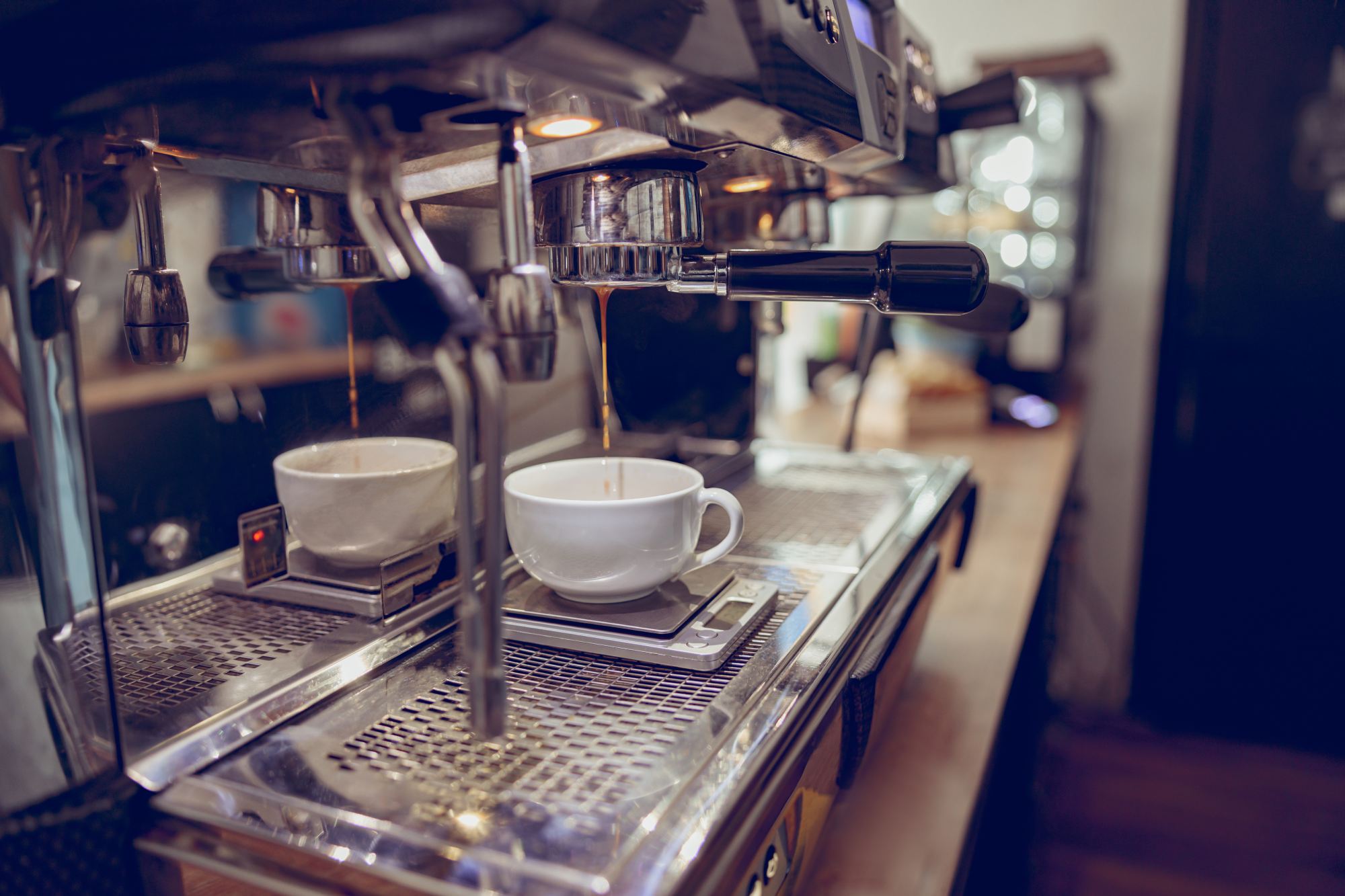 https://denbydalecoffee.co.uk/wp-content/uploads/2023/02/modern-coffee-machine-brewing-espresso-in-cafeteri-2022-02-16-19-55-35-utc-1.jpg